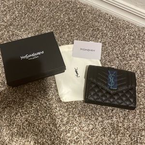 Brand new, spacious YSL black wallet.